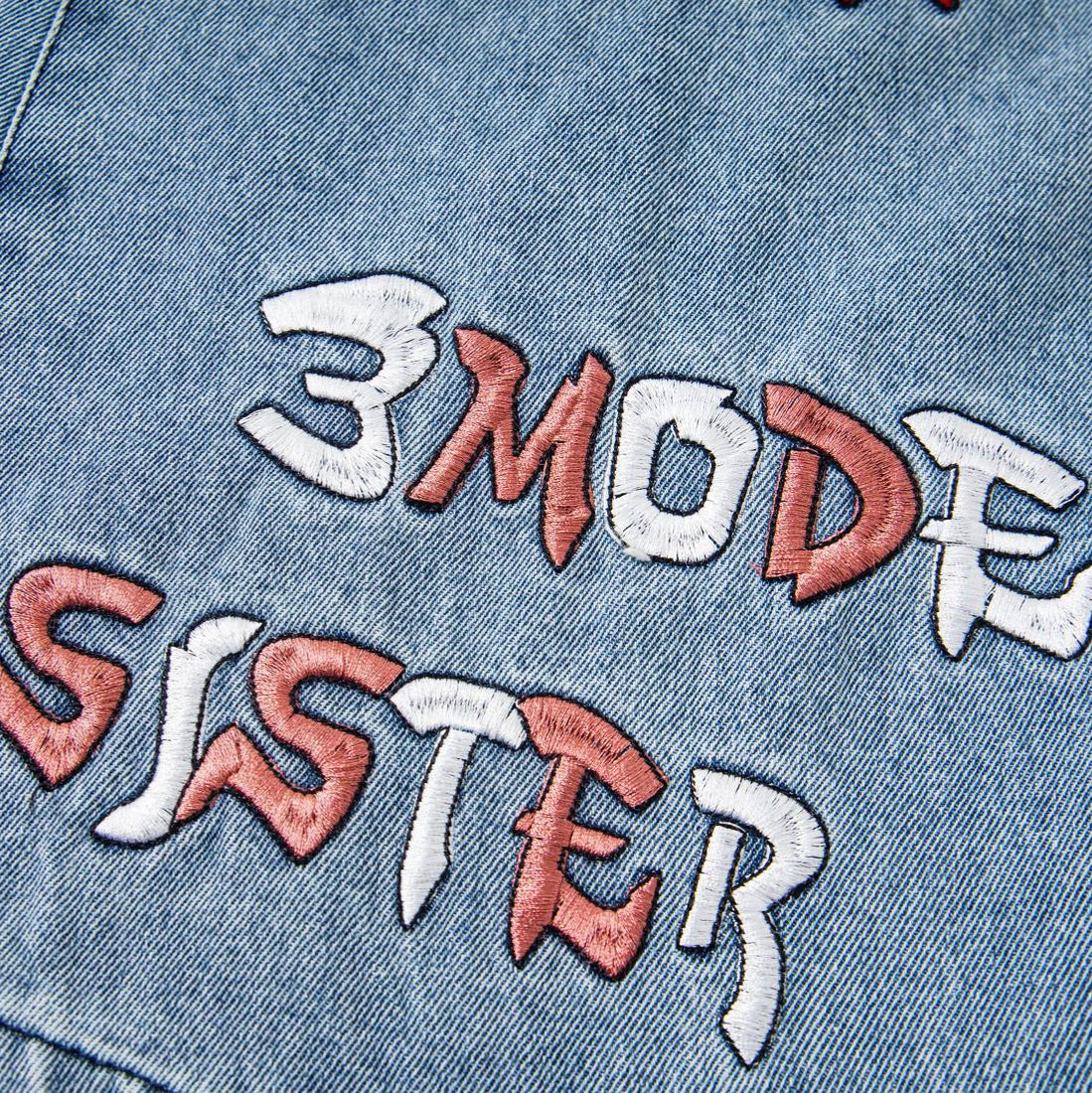 Embroidered washed denim jeans