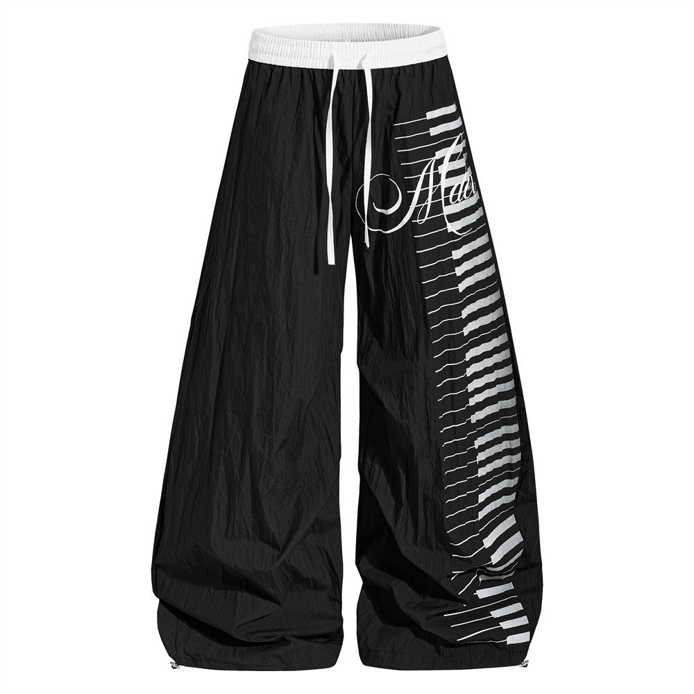 Piano key note printing curved knife wide leg pants product photo