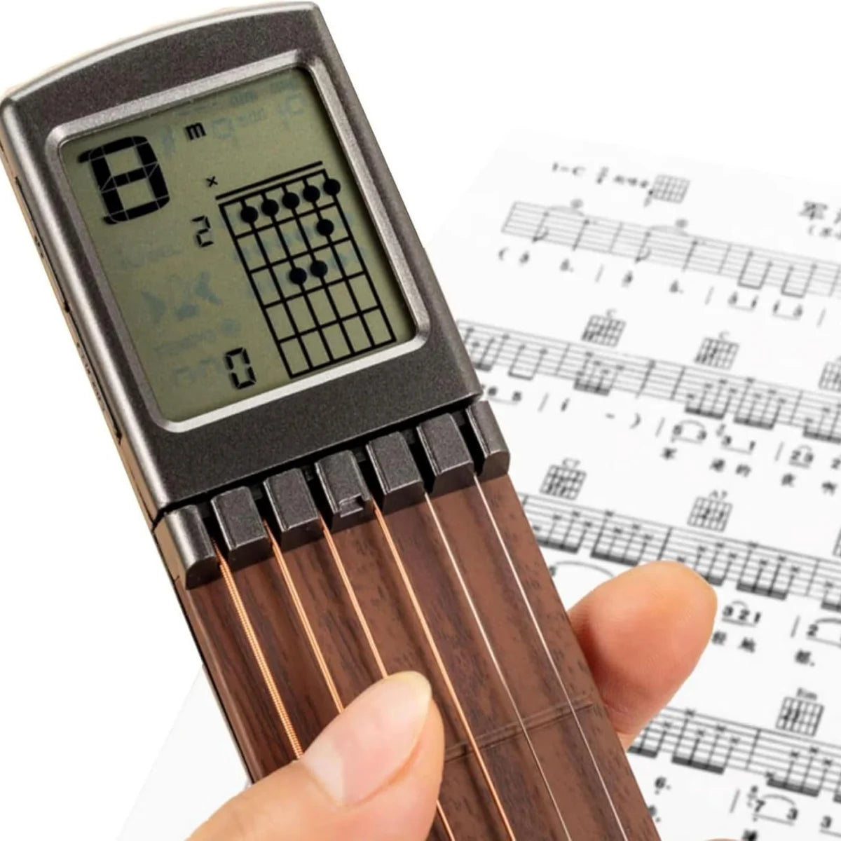 Close-up of the pocket guitar chord trainer display and practice controls